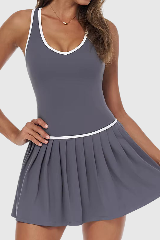 LUPPO grey 2-in-1 court dress with a pleated skirt, V-neckline, white contrast trim, and a racerback design.