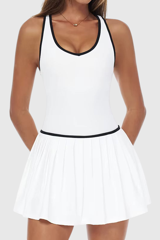 LUPPO white 2-in-1 athletic court dress with black contrast trim, pleated skirt, and racerback design on a model