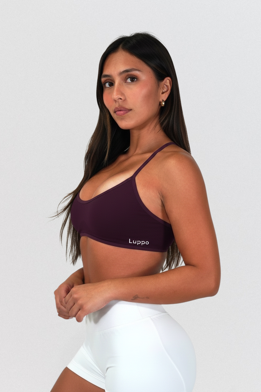 LUPPO dark purple backless training top with adjustable spaghetti straps and elastic underband on a model