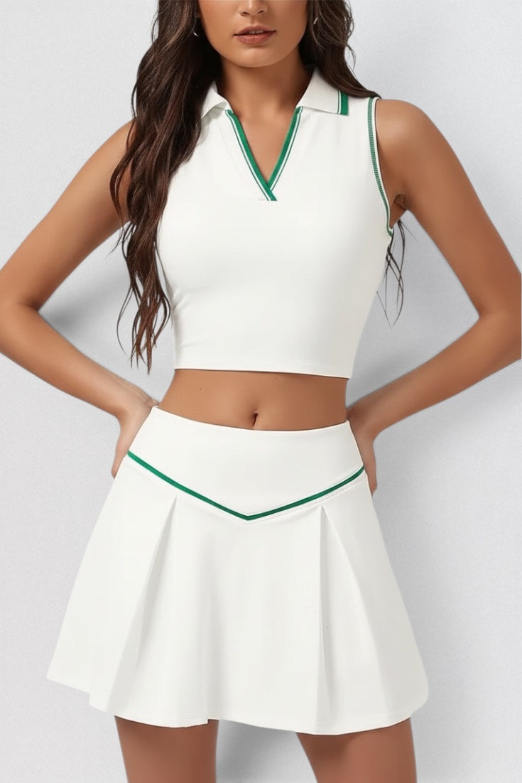LUPPO white sleeveless collared crop top and pleated skirt set with green contrast piping. Lightweight, high-stretch fabric.