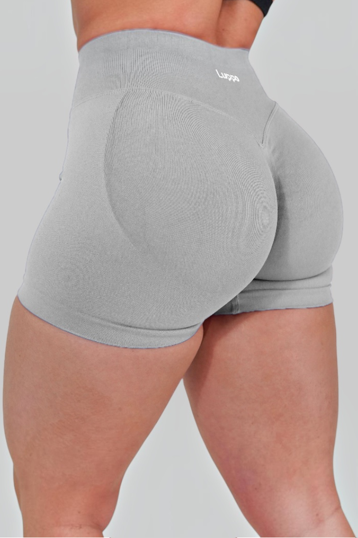 LUPPO grey high-waist workout shorts with glute contouring panels and a firm scrunch back for a sculpted fit.